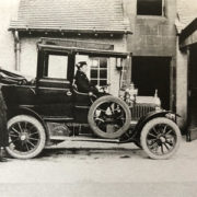 Mr Blyth with car at The coach house, Balvonie